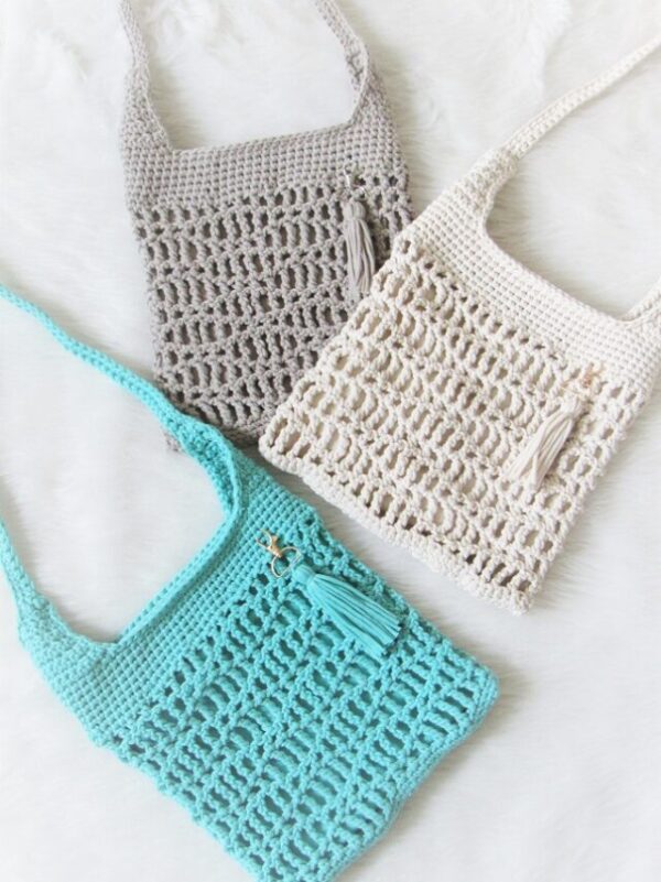 Bag made using the how to crochet a bag for beginners step by step tutorial in blue, cream and gray color