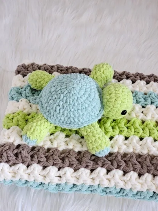 Amigurumi turtle on a folded crochet blanket