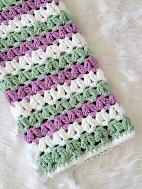 Blanket crochet pattern finished in Purple, sage and white.
