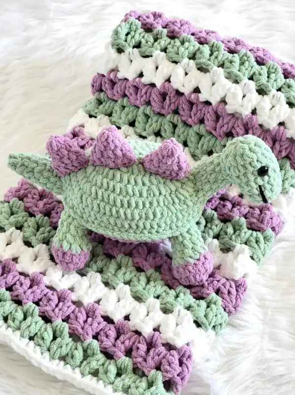 Crochet dinosaur pattern finished in green and purple colors