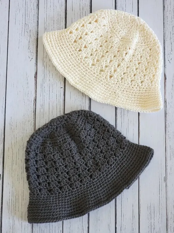 2 crochet bucket hats in cream and gray colors