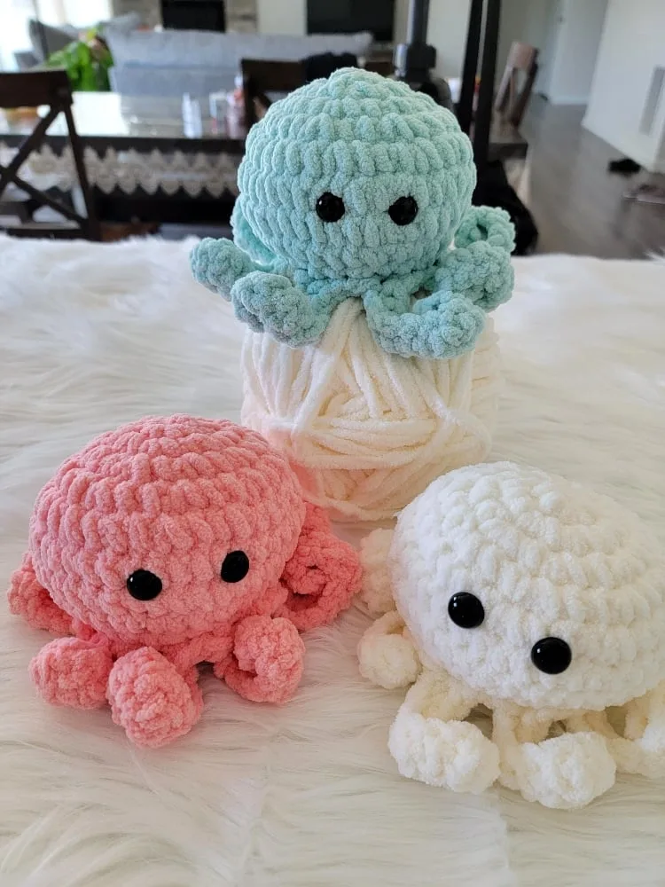 Crochet octopus plushie in peach blue and cream closeup