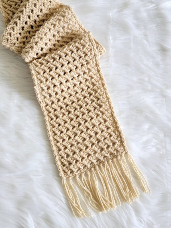 crochet scarf on cream color displayed on fur