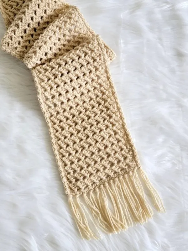 crochet scarf on cream color displayed on fur