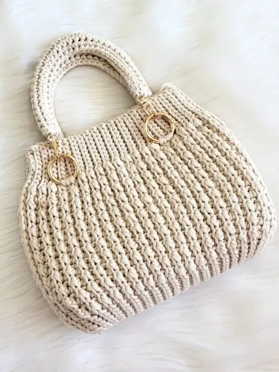 Crochet mini bag with golden buckles