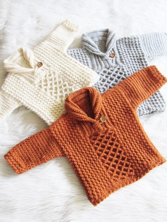 Crochet baby sweater in gray, cream and orange colors