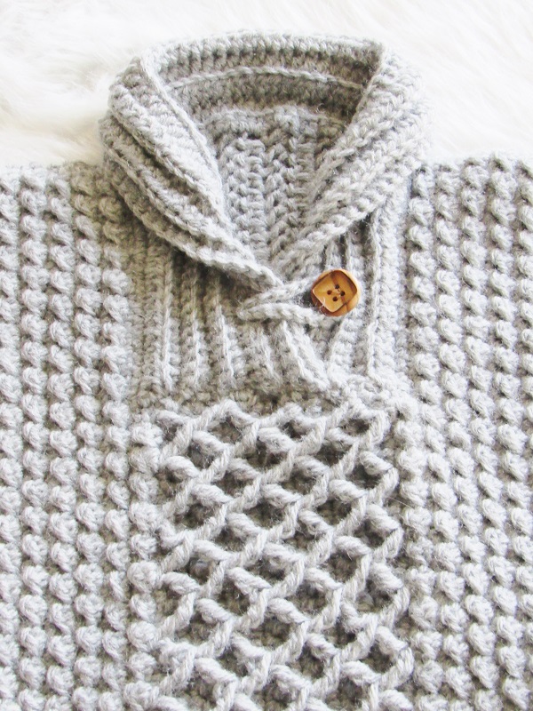 Closeup of crochet baby sweater collar