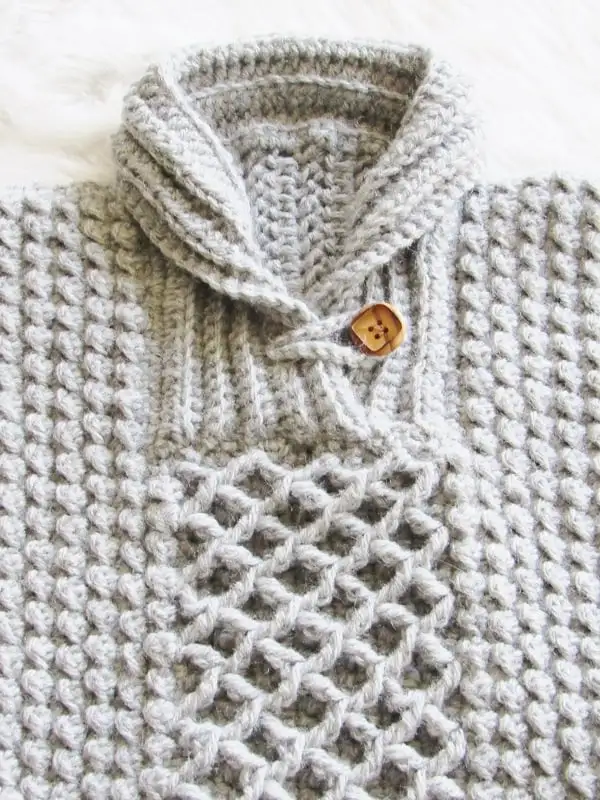 Closeup of crochet baby sweater collar