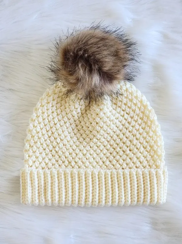 Cream color crochet beanie with fur pom pom