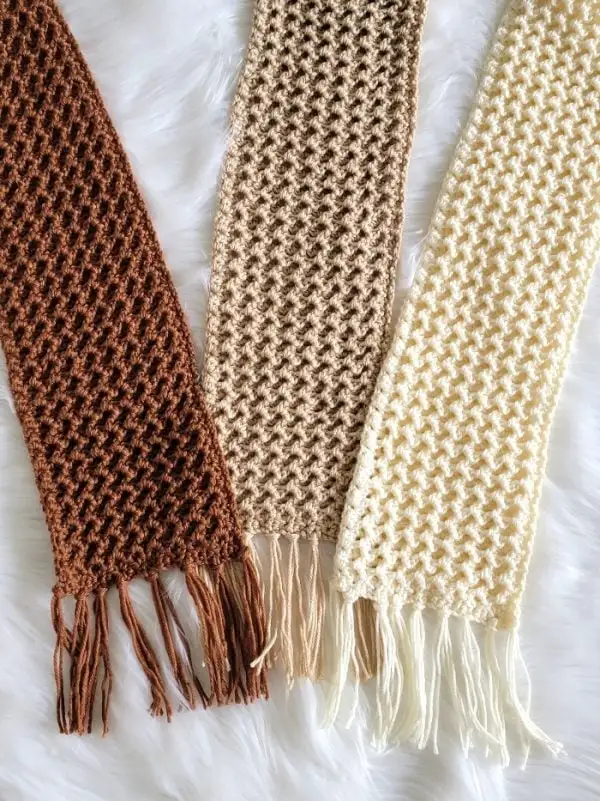 crochet winter scarf finished in brown, beige and cream colors with tassels