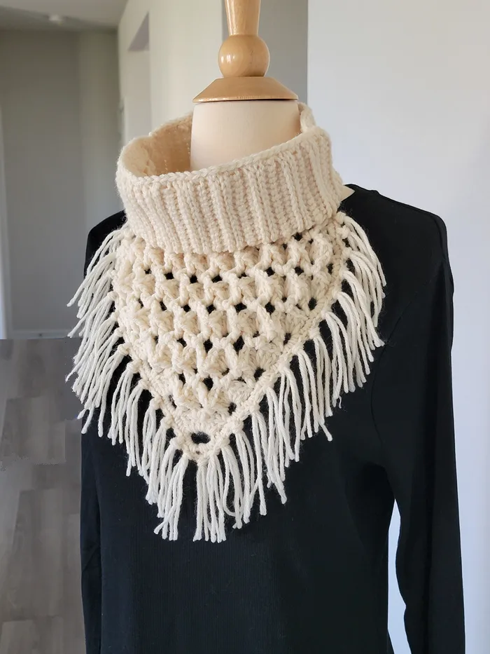 Crochet Bandana cowl with fringes in cream color modeled on a mannequin