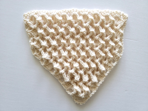 Finished triangle part of crochet bandana cowl in cream color