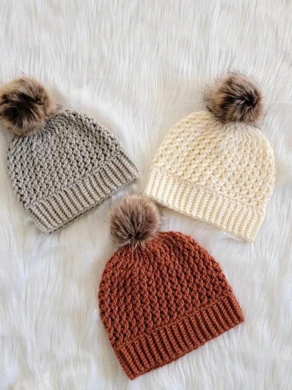 Crochet beanie finished in cream, orange and gray colors