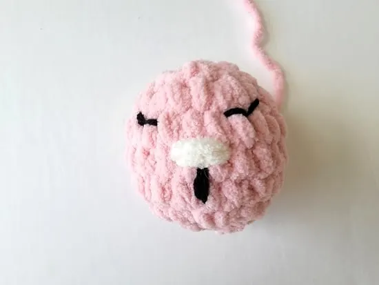 Finished head of crochet bunny lovey with facial features
