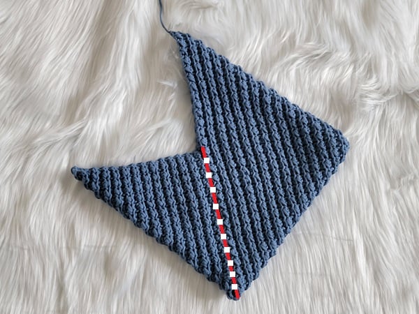 Seam the crochet hobo bag along the red line shown