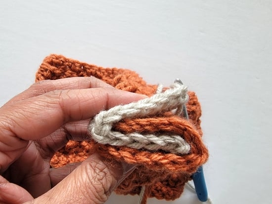 Two ends of the headband folded like a C and inserted into each other