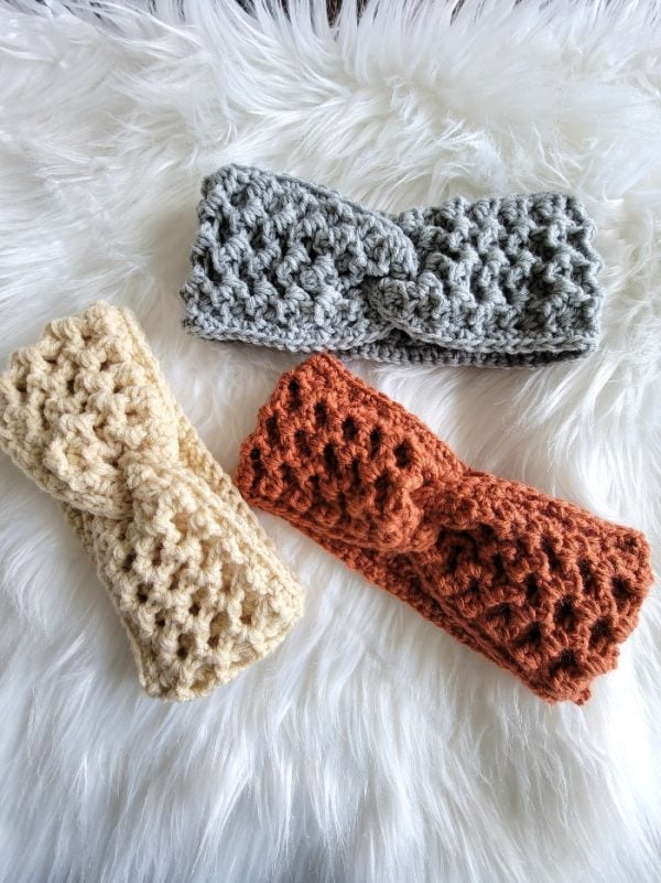 crochet headband finished in gray, cream and burnt orange colors