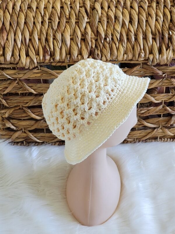 Cream crochet bucket hat on a mannequin head