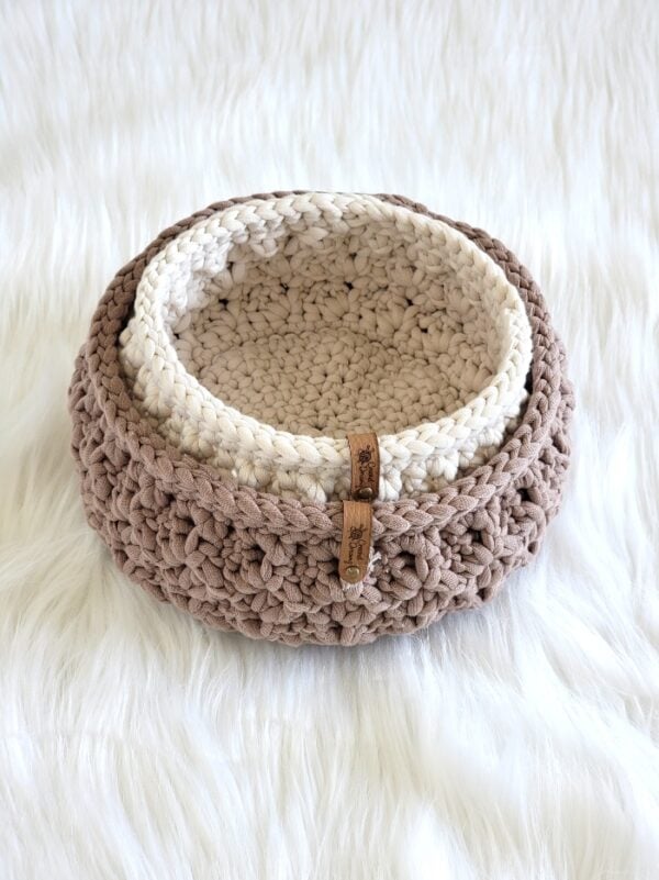 Two finished crochet baskets nested