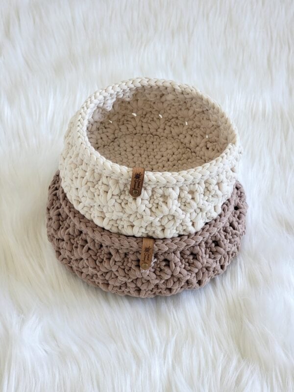 Two stacked crochet baskets, big and small