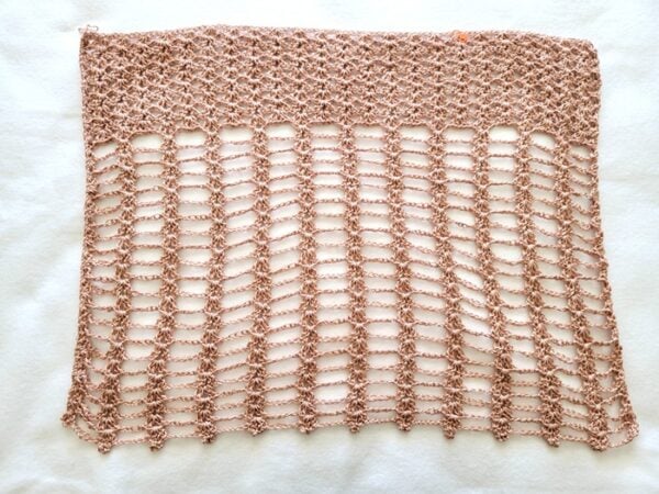 Finished front of poncho with lacy stitch