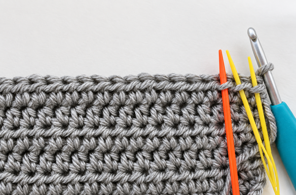 Needles inserted into third loops in front of hdc stitches